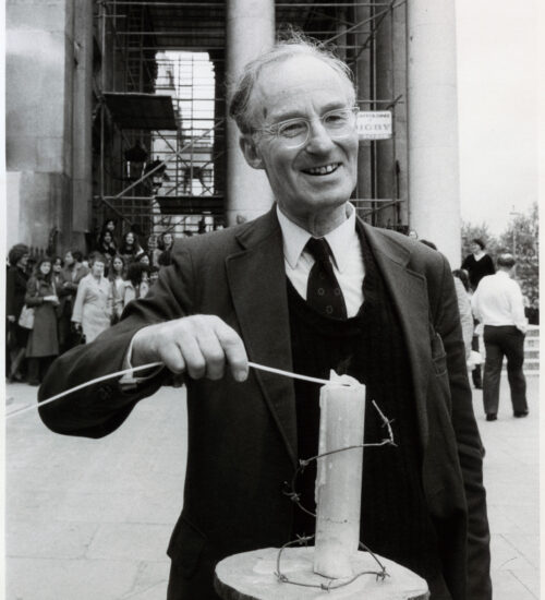 Peter Benenson, the British lawyer who founded Amnesty International in 1961, rekindles the original candle on the movement's 20th anniversary, outside St Martin in the Fields Church, London, UK, May 1981.