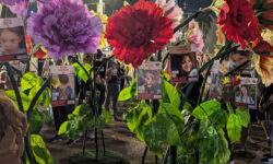 An installation in “Hostages Square” (official name “Tel Aviv Museum Plaza”), of adult human size flowers with signs of children hostages, some as young as 9 months old, kidnapped on the 7 October 2023 Hamas-led attack on Israel, which resulted in more than 200 hostages, most of them Israeli, being taken to Gaza, and more than 1,200 civilians, mostly Israelis, were killed.